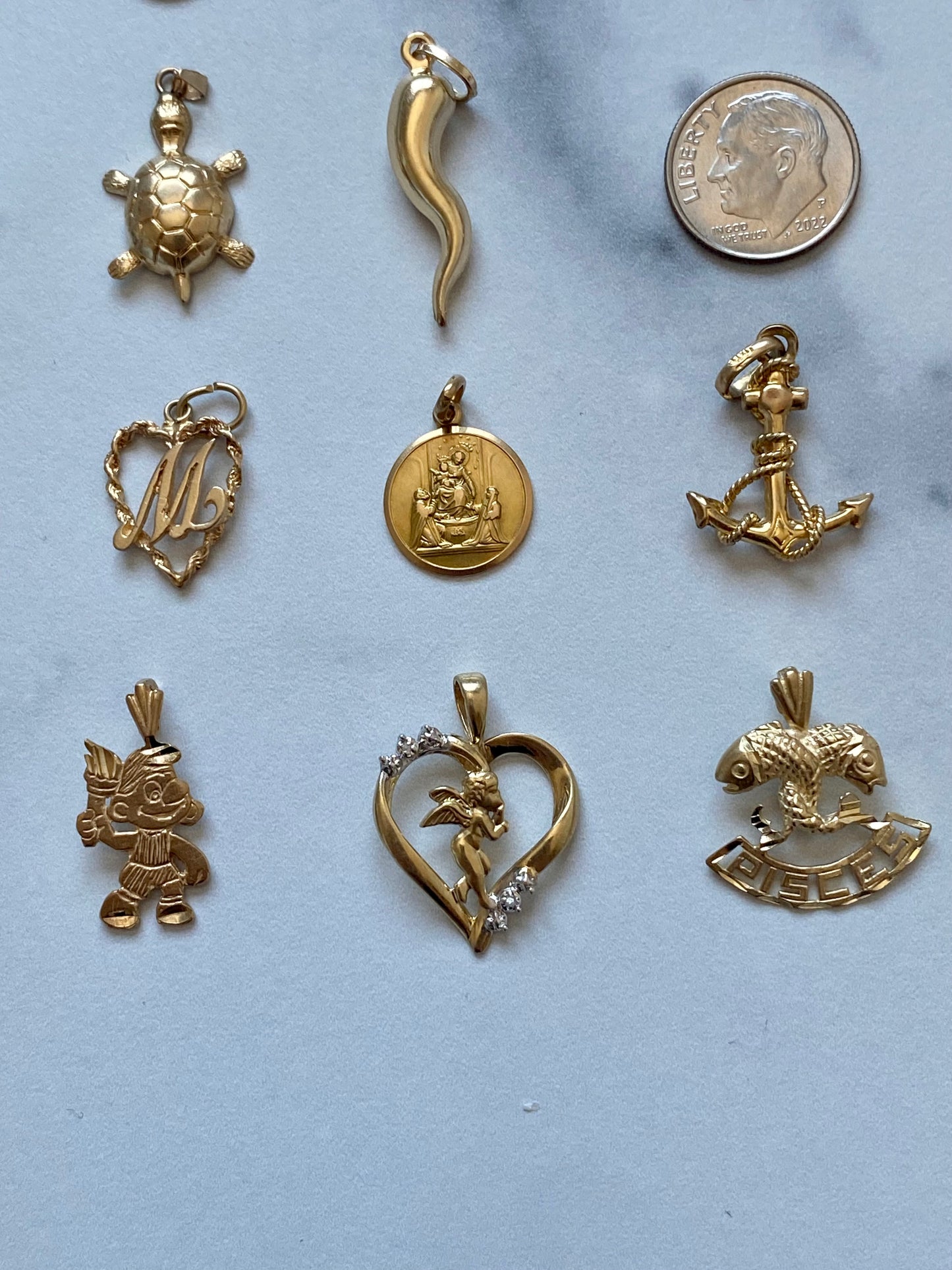 Small gold pendants and charms