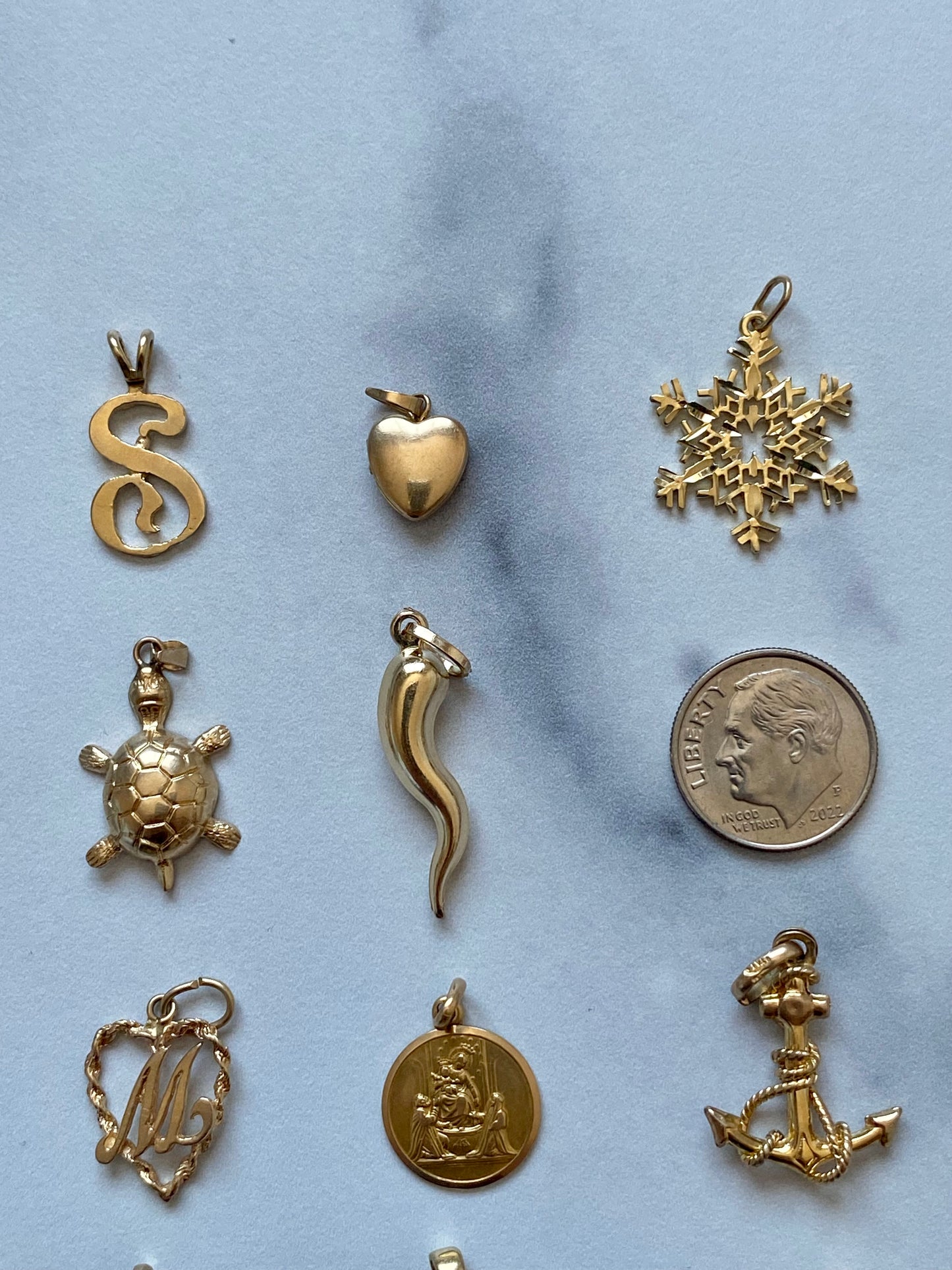 Small gold pendants and charms