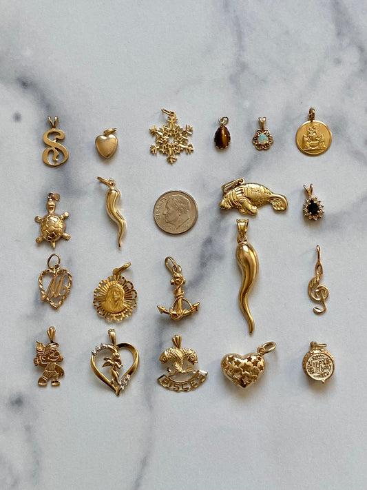 Small gold pendants and charms