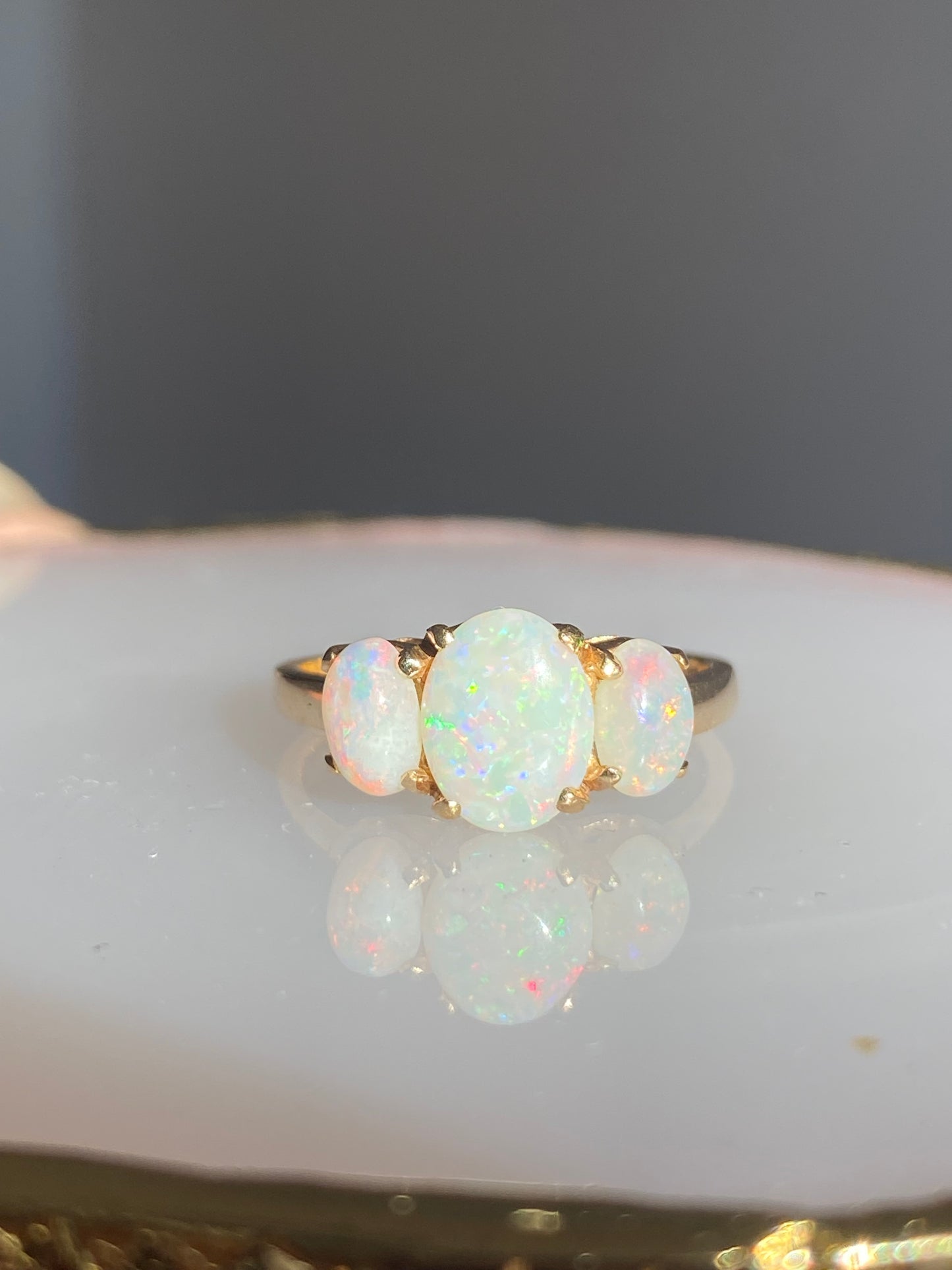 Three stone white opal ring