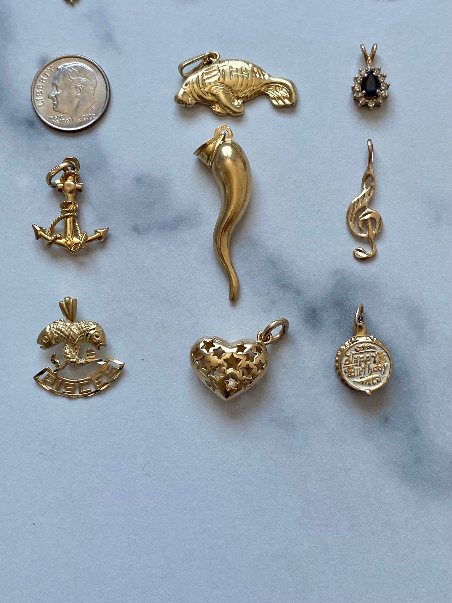 Small gold pendants and charms