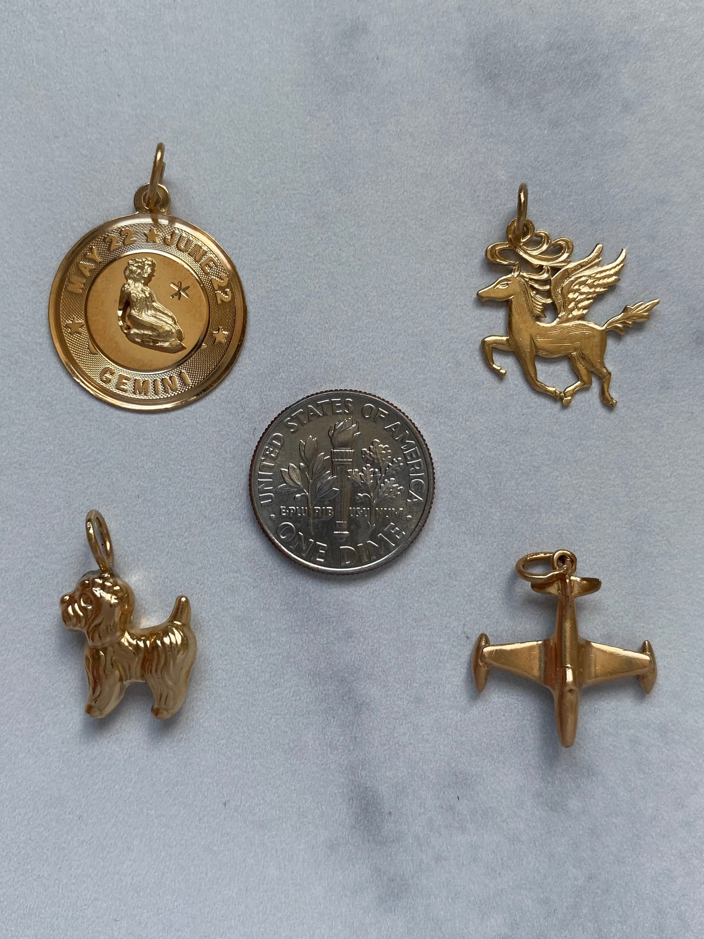 Small gold pendants and charms