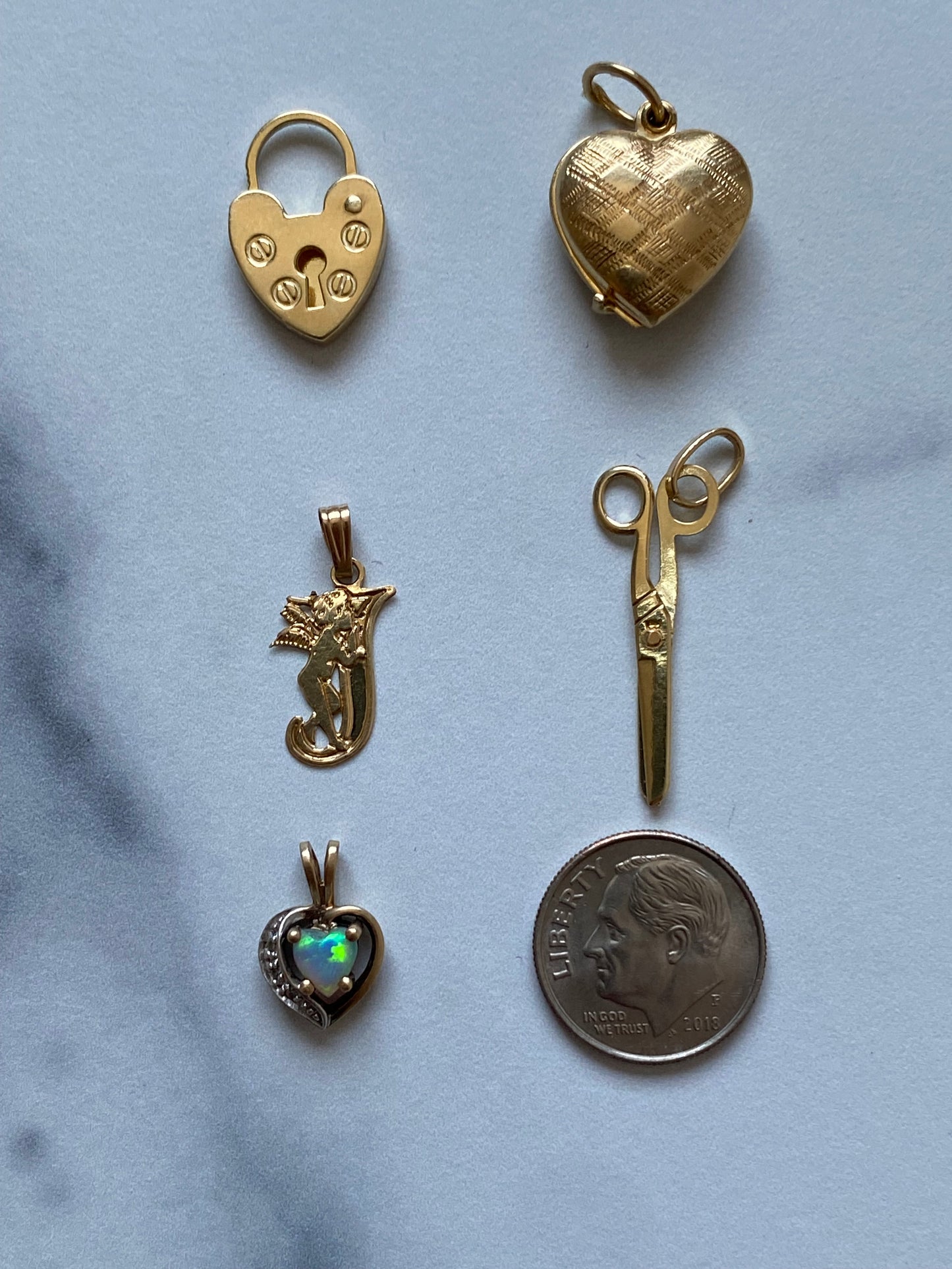 Small gold pendants and charms