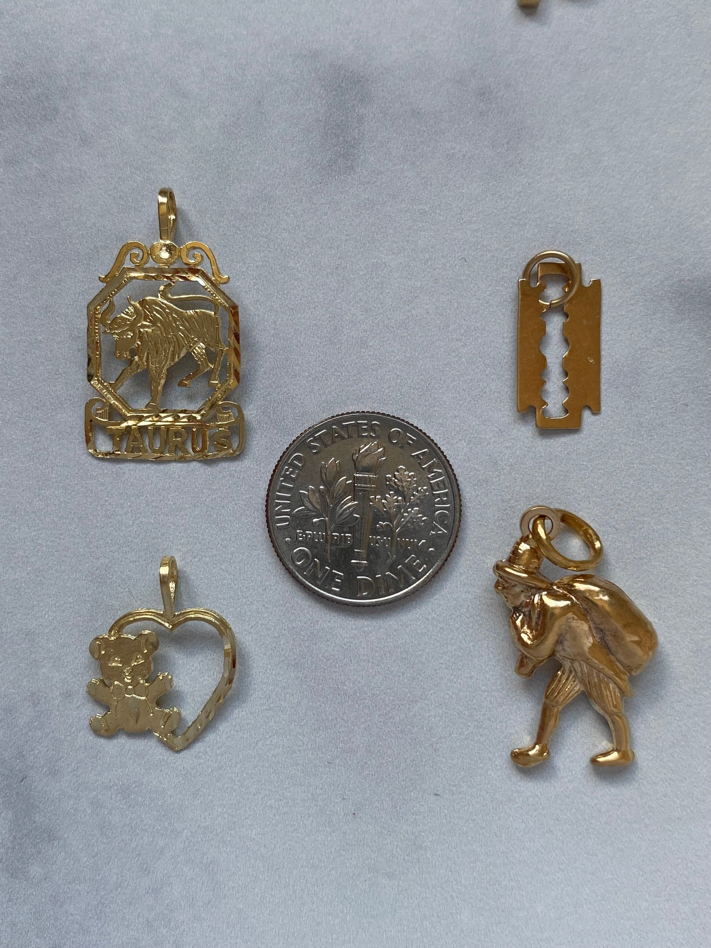 Small gold pendants and charms