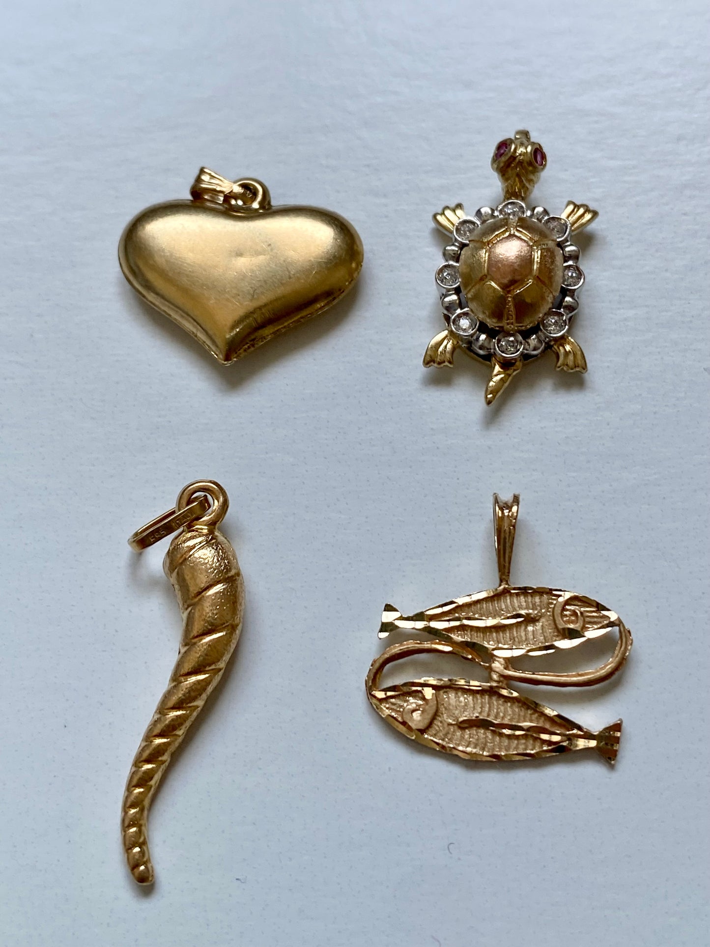 Small gold pendants and charms