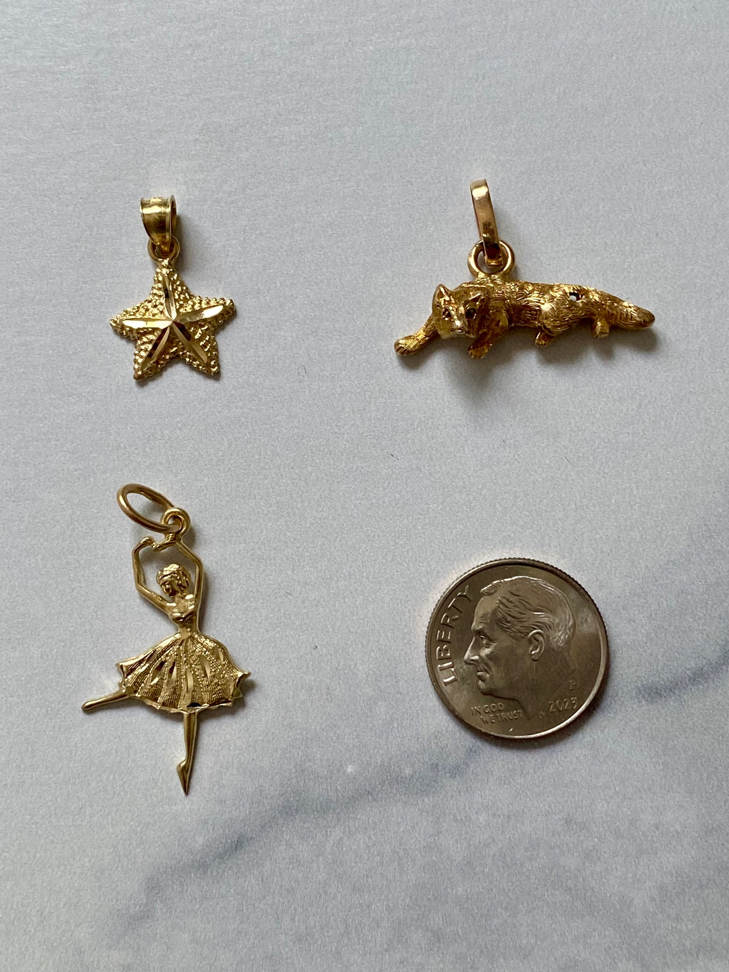 Small gold pendants and charms