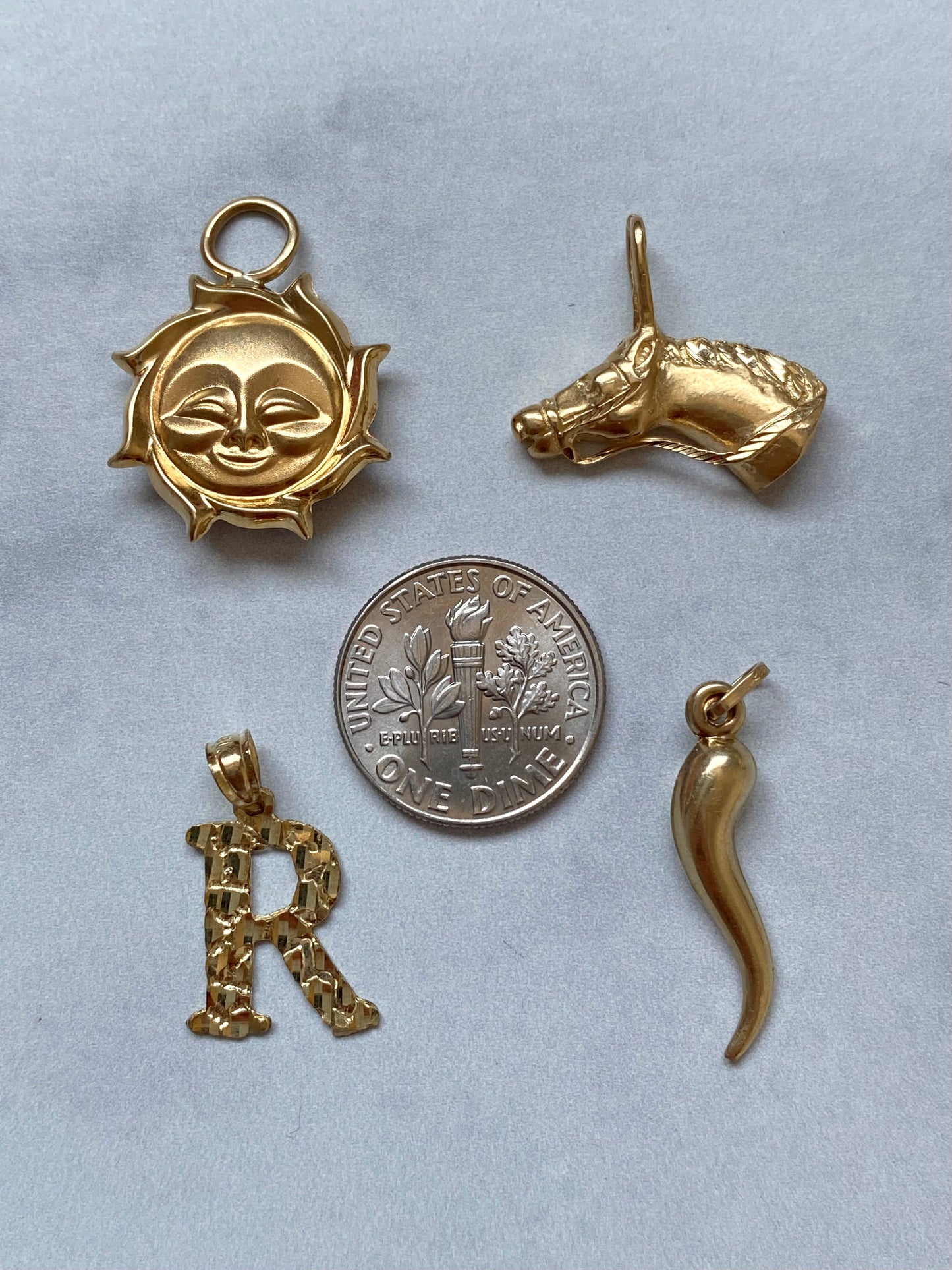 Small gold pendants and charms