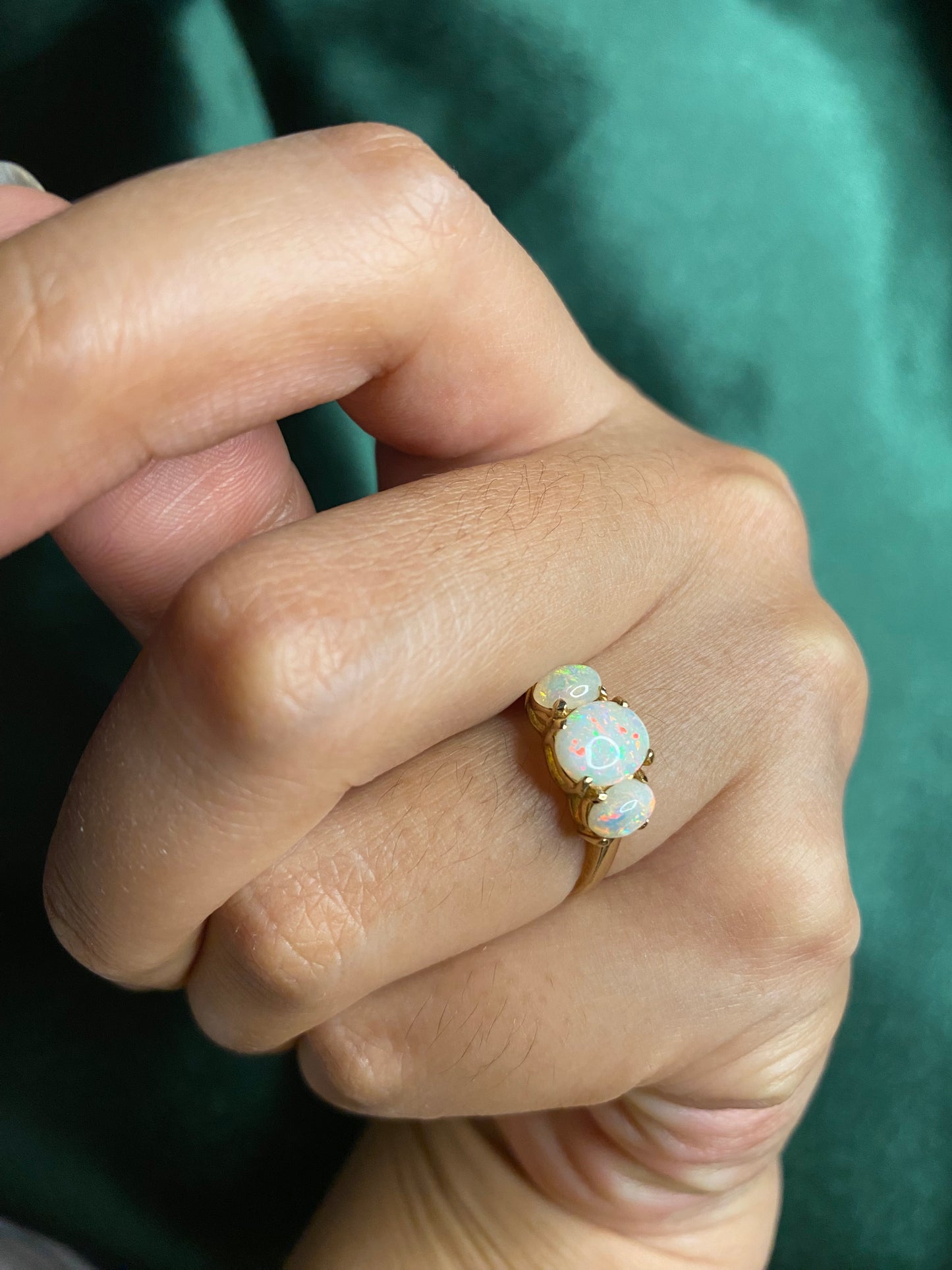 Three stone white opal ring