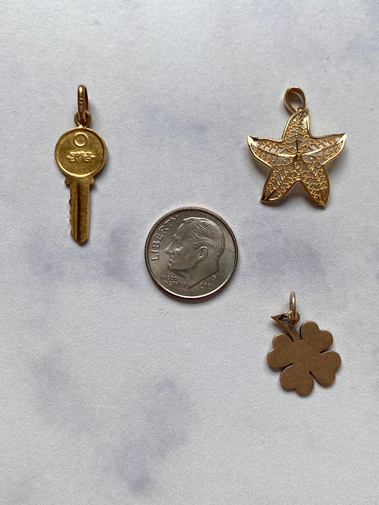 Small gold pendants and charms