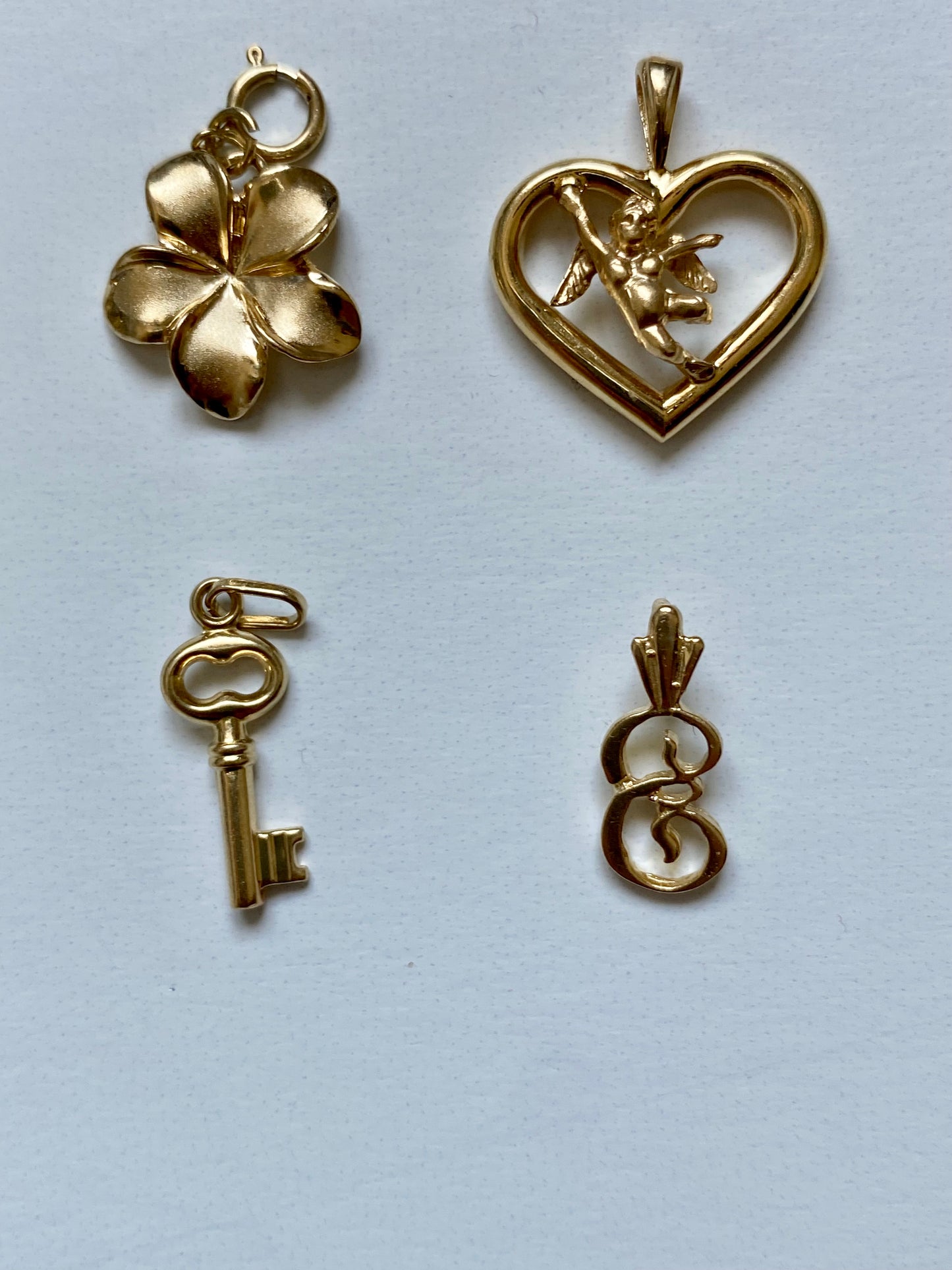 Small gold pendants and charms