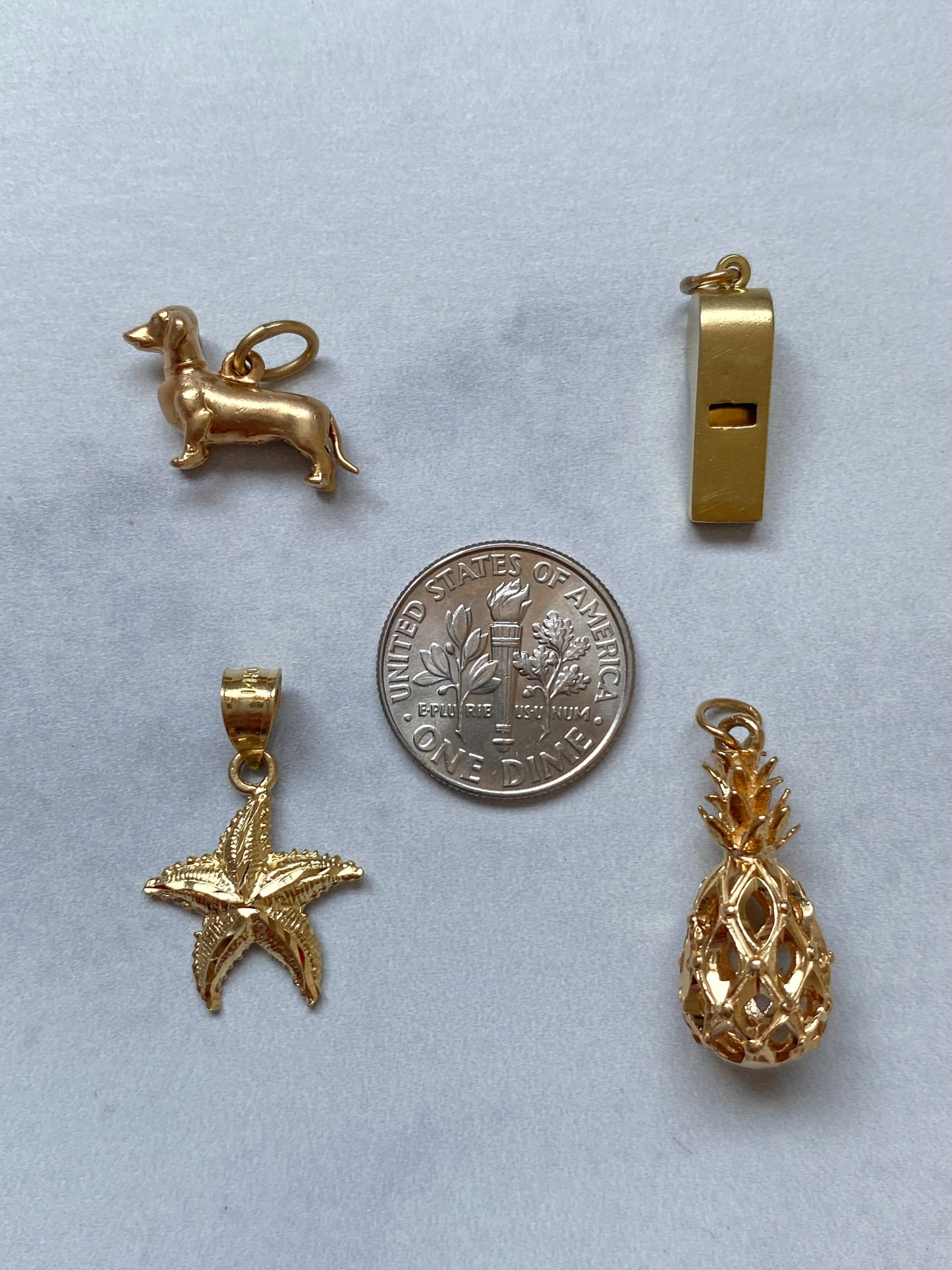 Small gold pendants and charms