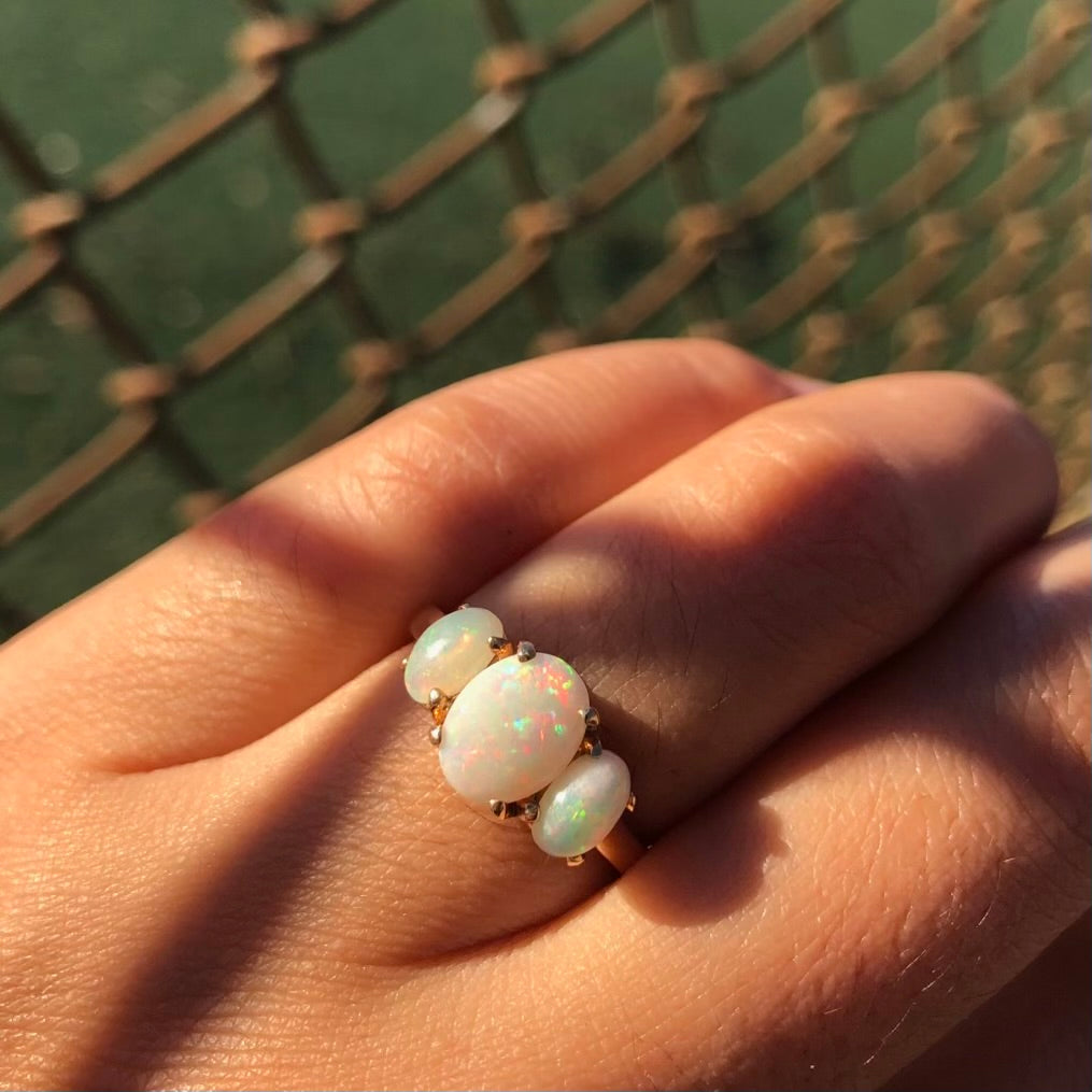 Three stone white opal ring