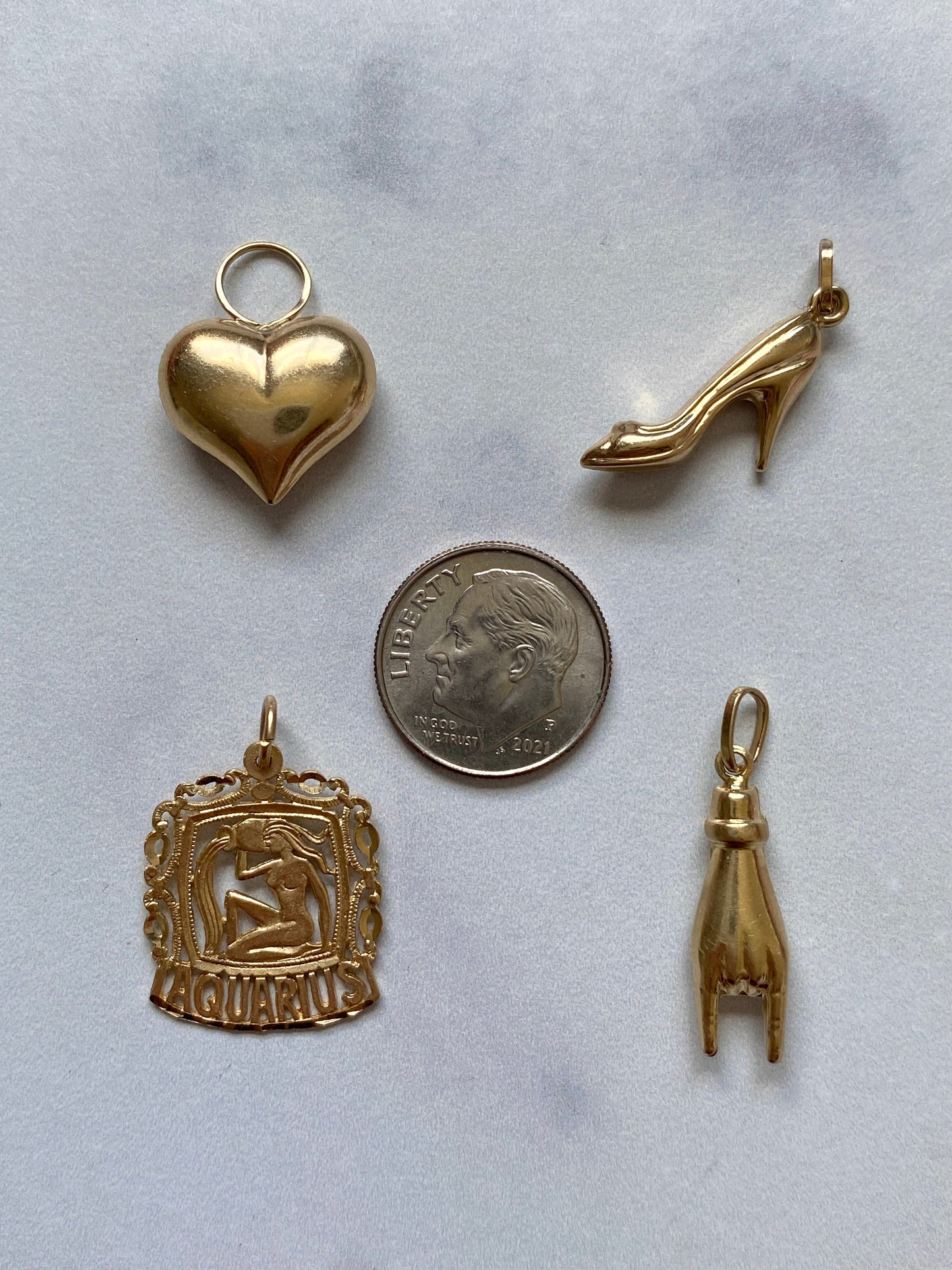 Small gold pendants and charms