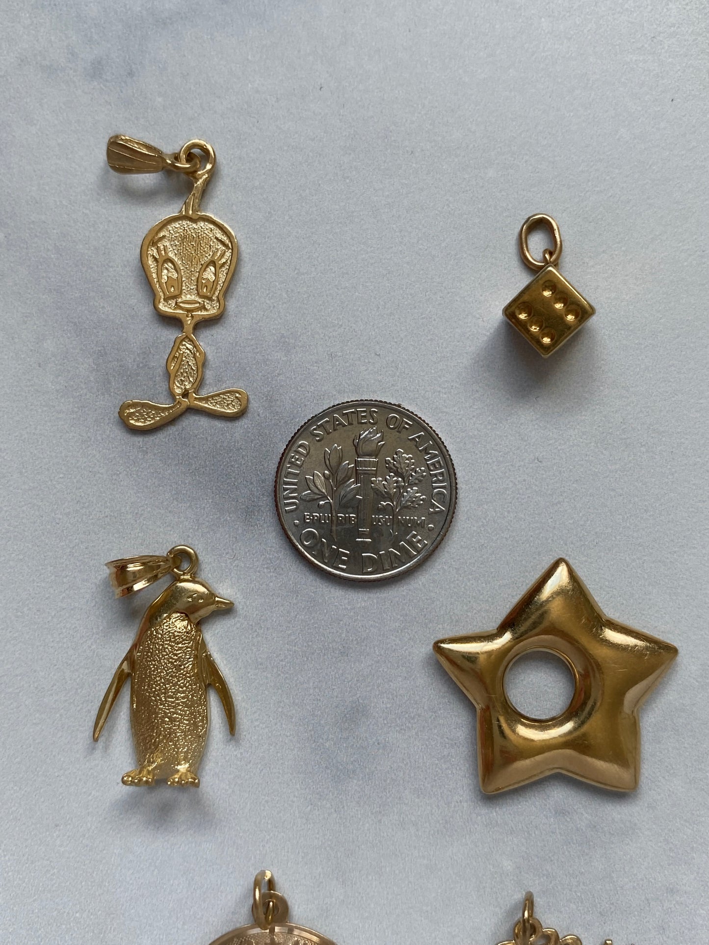 Small gold pendants and charms