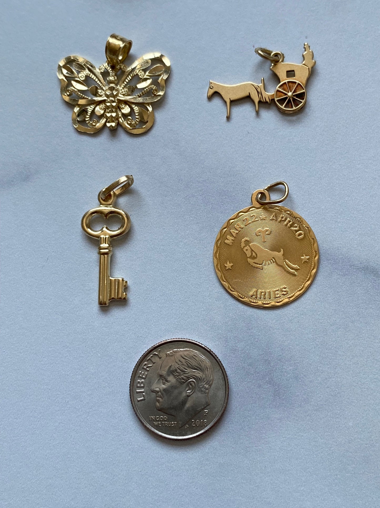 Small gold pendants and charms