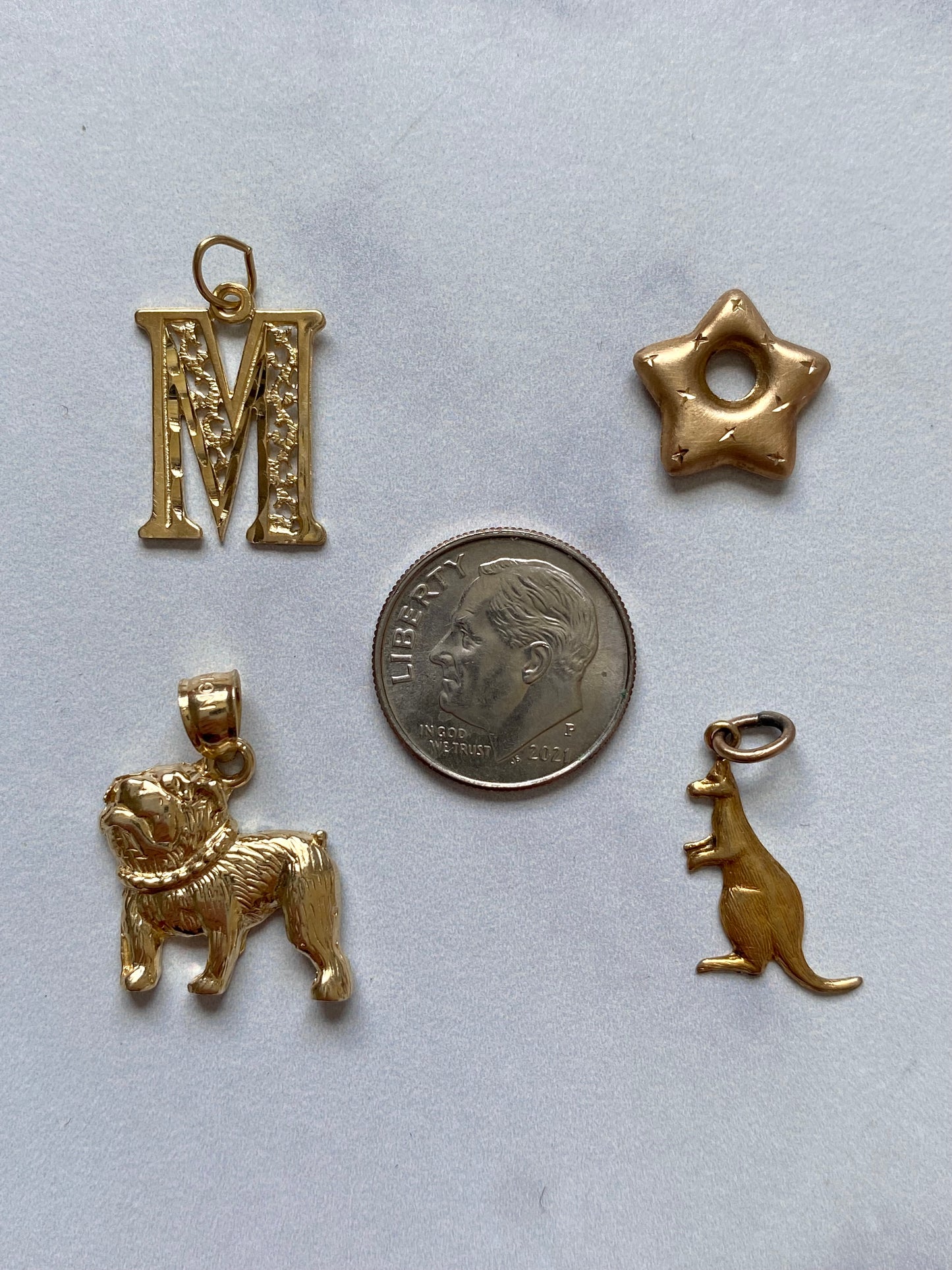 Small gold pendants and charms