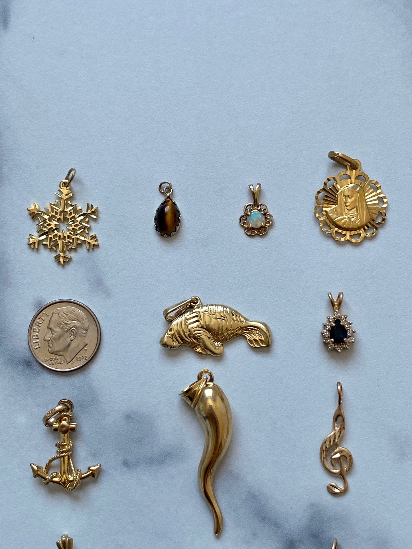 Small gold pendants and charms