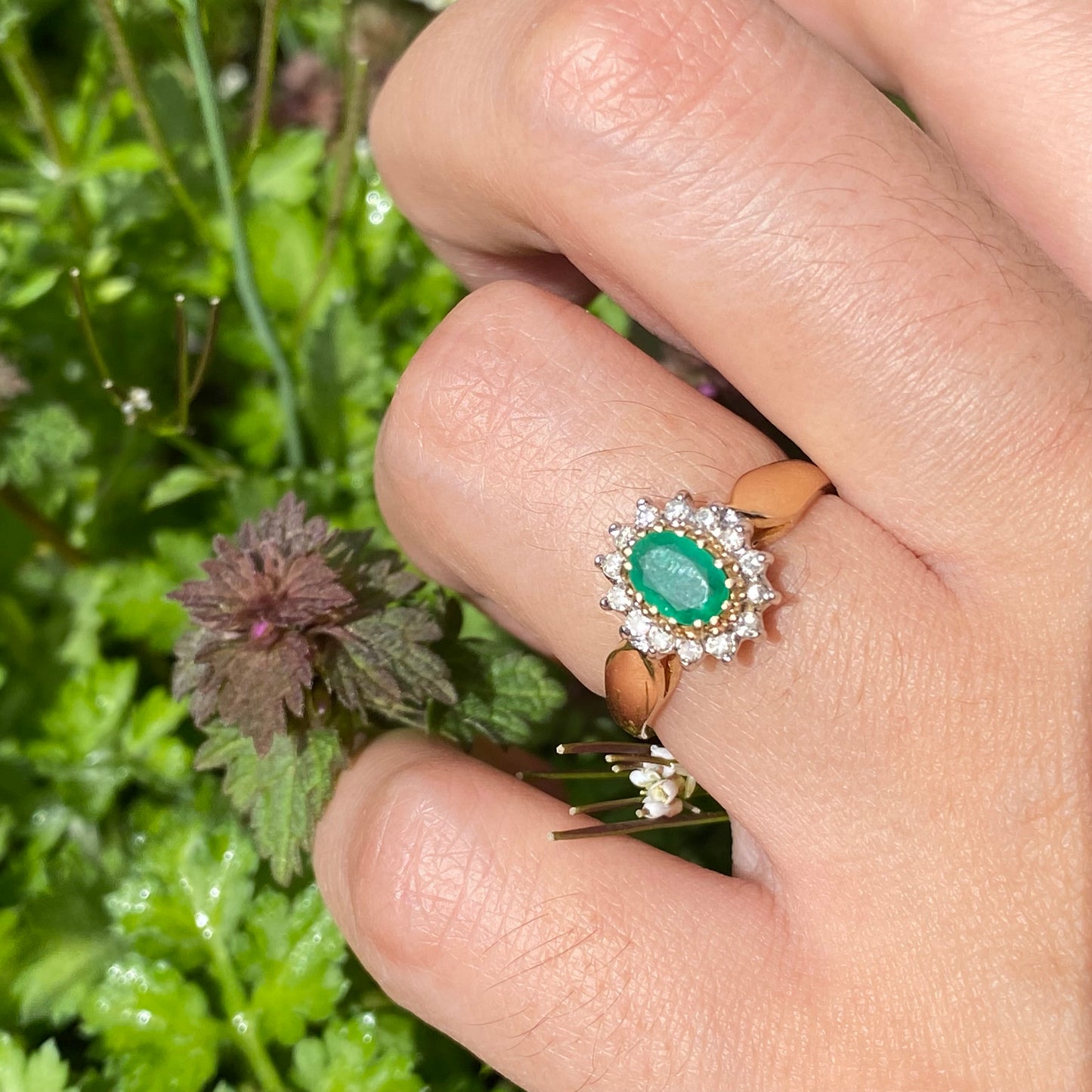 Emerald and diamond cluster ring