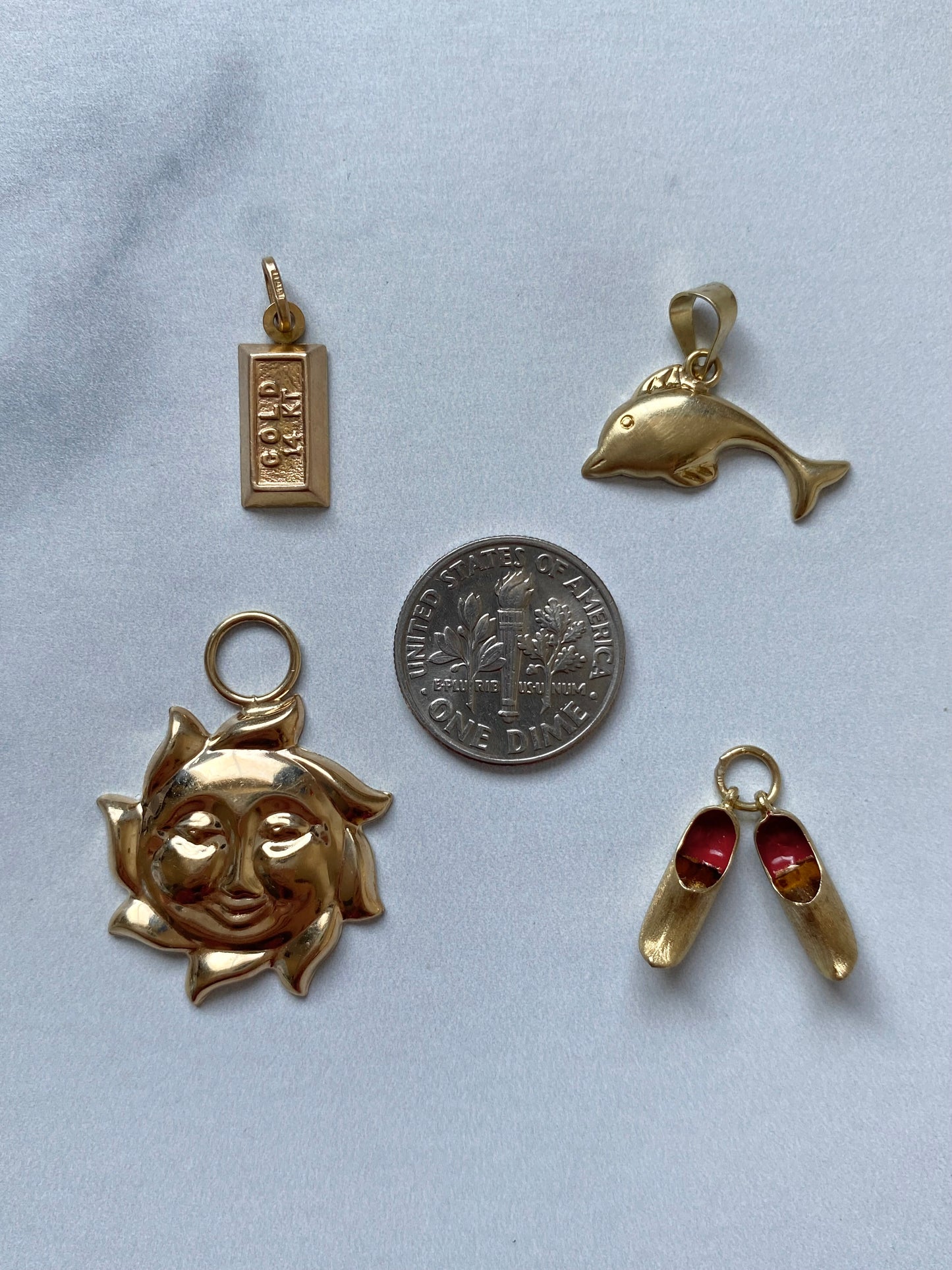 Small gold pendants and charms