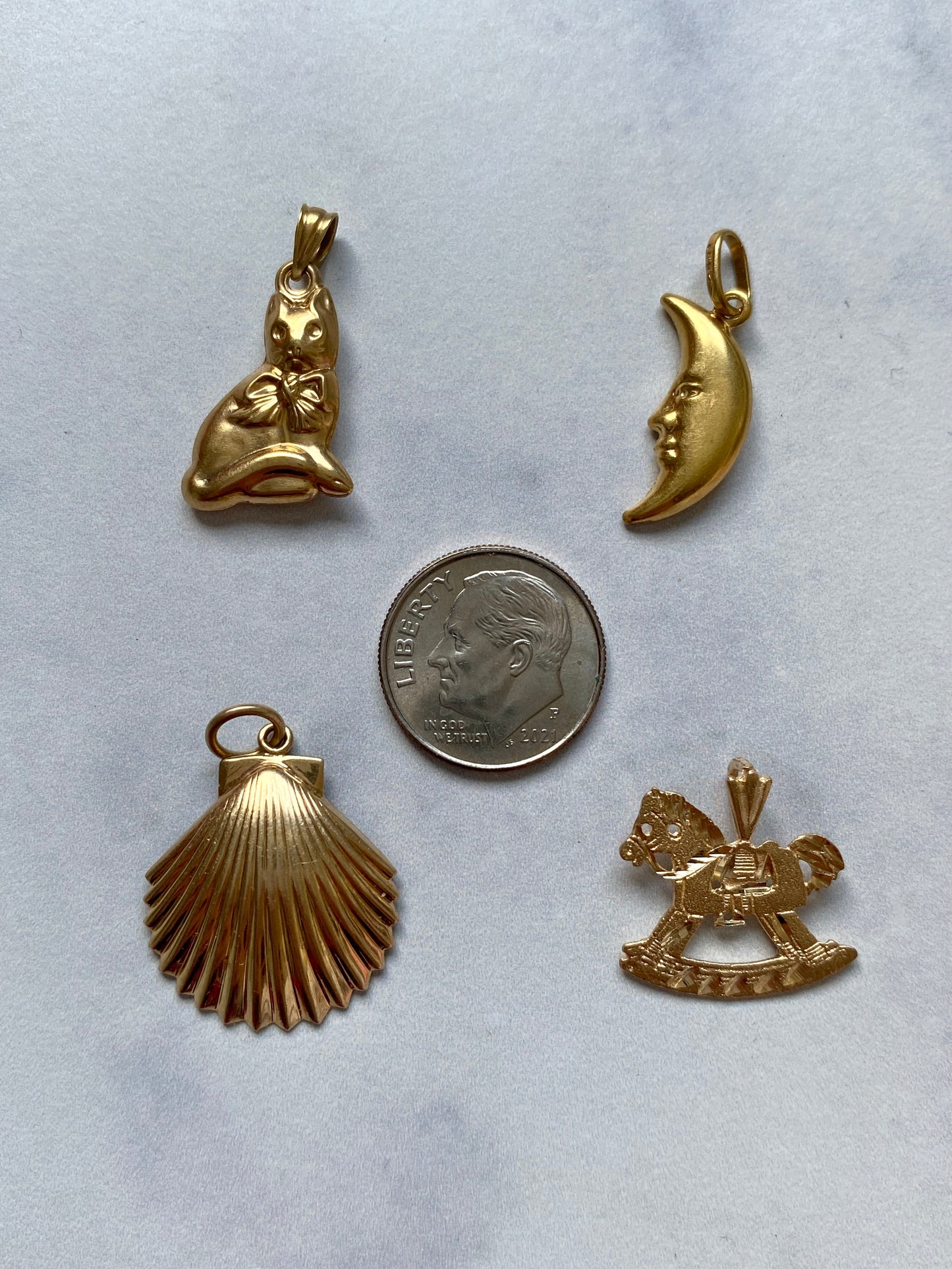 Small gold pendants and charms