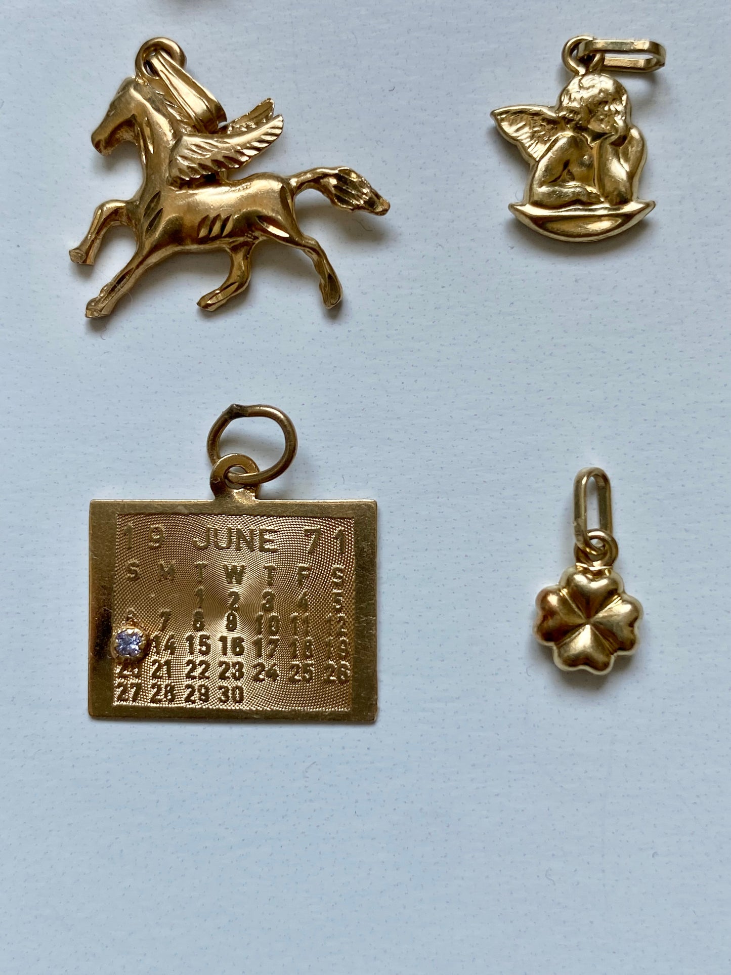 Small gold pendants and charms