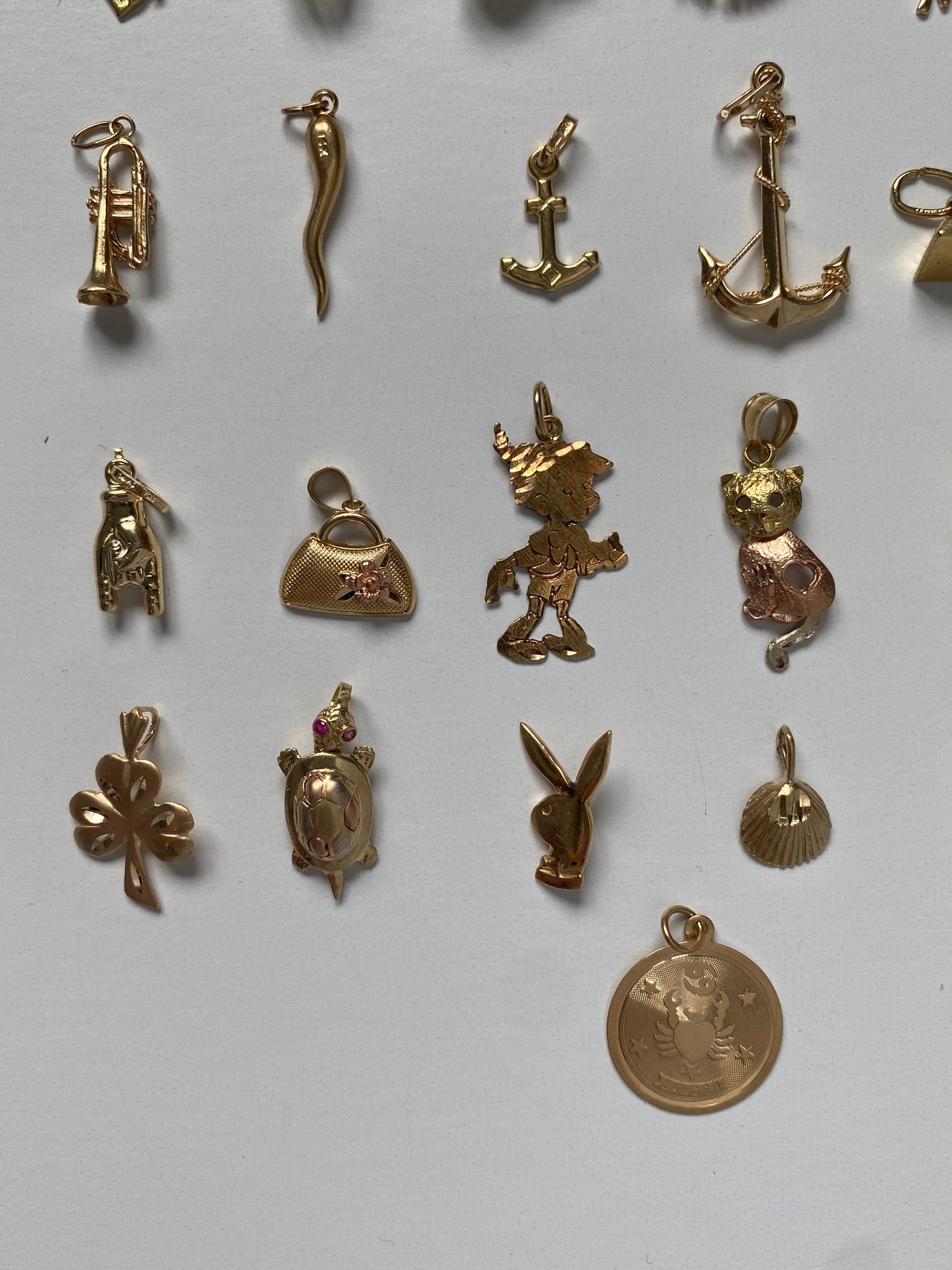 Small gold pendants and charms