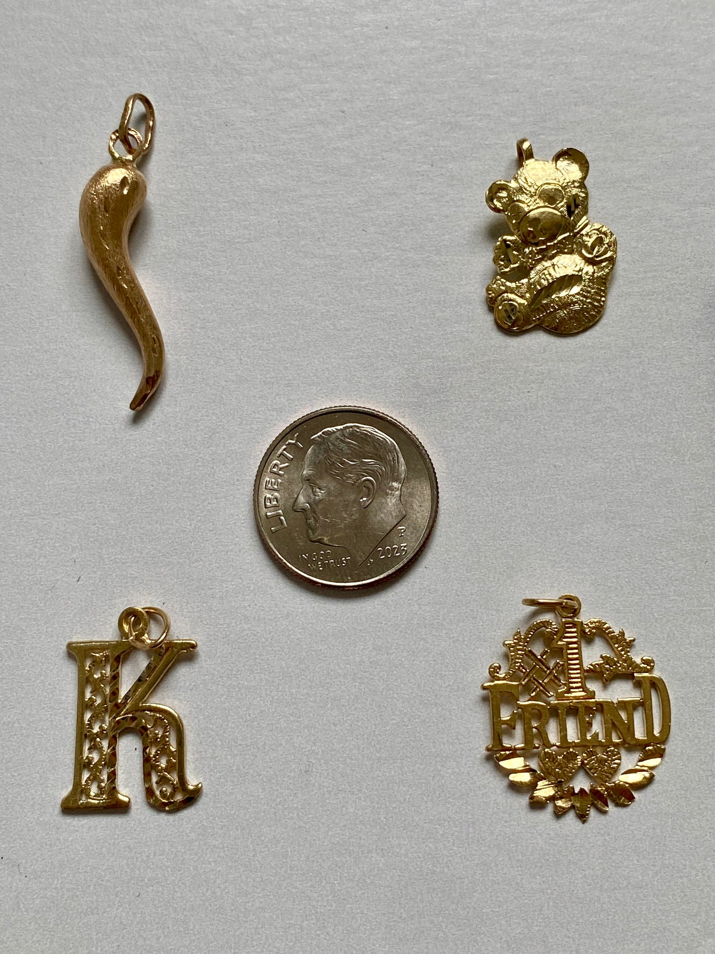 Small gold pendants and charms