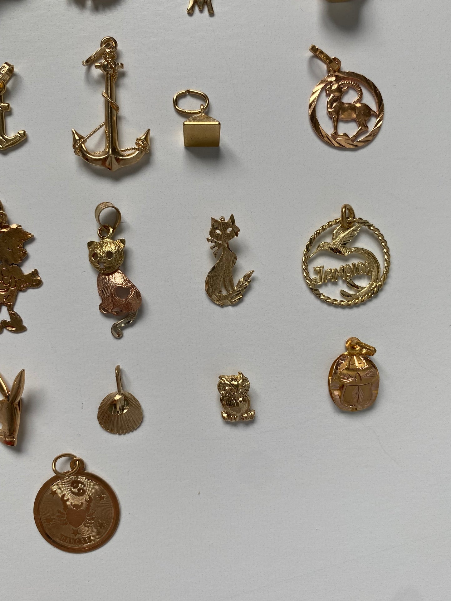 Small gold pendants and charms